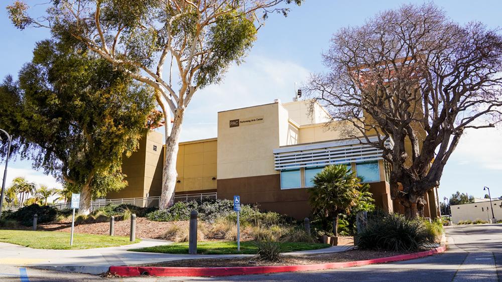 photo of the side of the performing arts building at ventura college with two trees on either side
