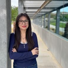 Susana Espinosa standing with arms crossed