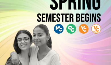 Two college students with one arm wrapped around the other. 