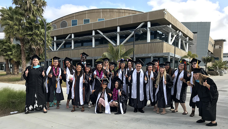 Photo of the front of LRC with graduates from the program 20