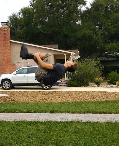 Roman Becher, VC Student doing a back flip