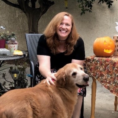 Rhonda Carlson sitting and petting her dog