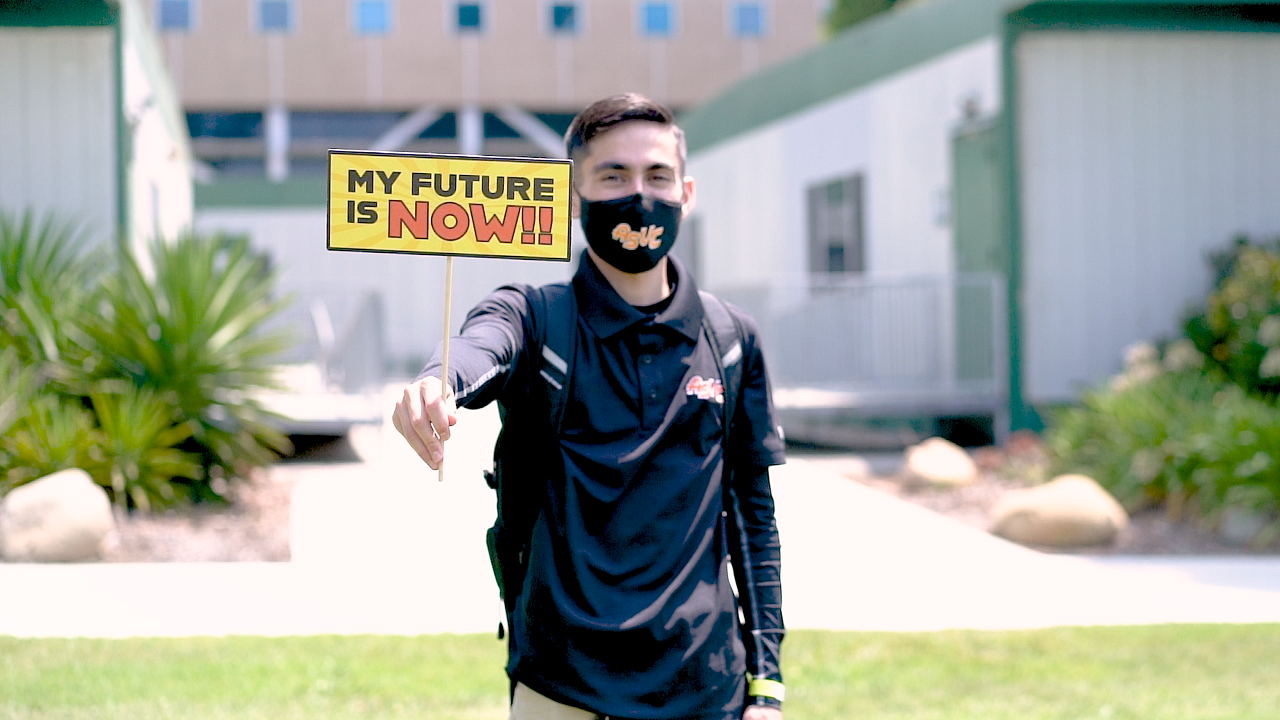 VC Student holding sign that says "My Future Is Now"