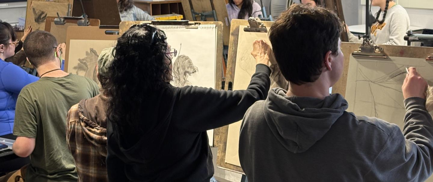 Students sketching in a classroom