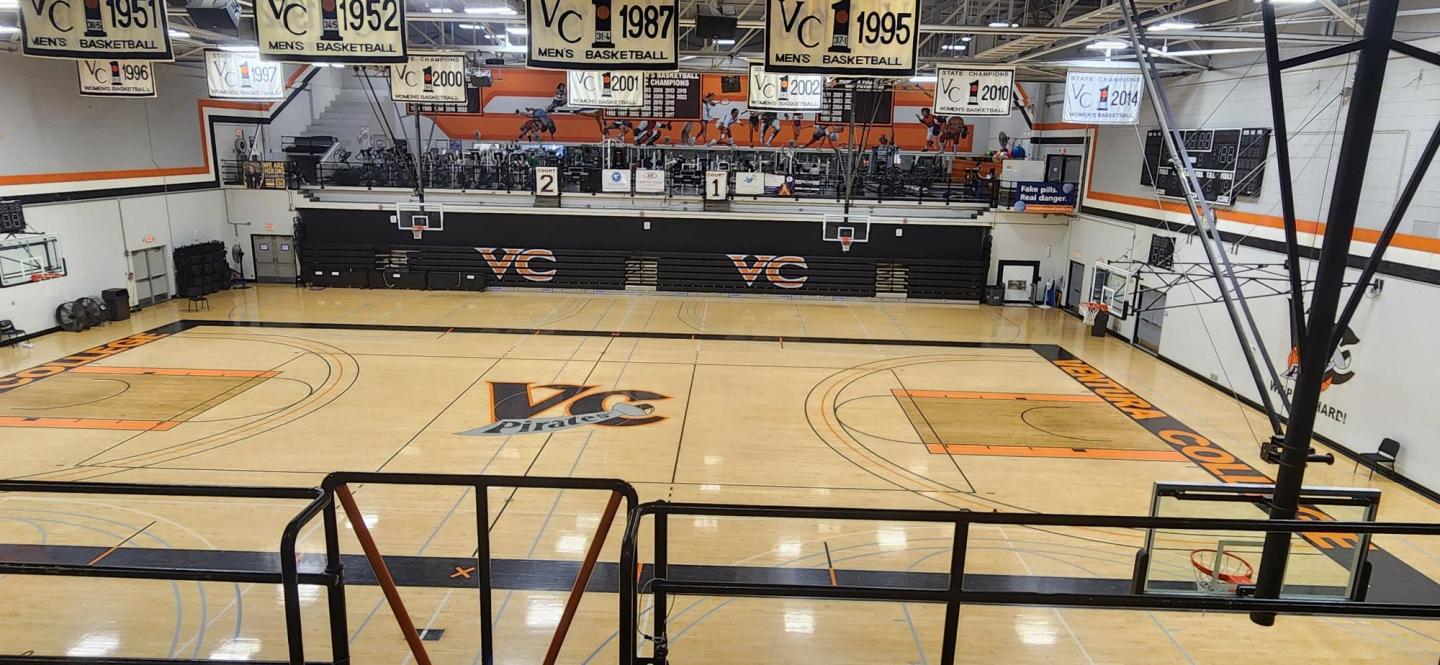 A photo of the gymnasium bleachers. The photo was taken from the East entrance bleachers facing towards the west entrance wear the workout space is.