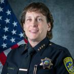 Police Chief Kelli Florman, white woman with short curly bro