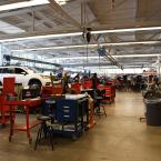 Photograph of students in the Ventura College Automotive Career Education Lab working on cars.