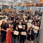 Ventura College Stan Weisel Tutoring Center staff and newly certified CRLA Level One tutors gather in the tutoring center and hold their certification documents.