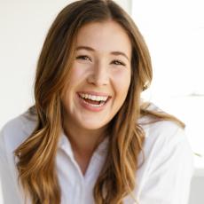 Mallery Kinnun smiling in white collared shirt