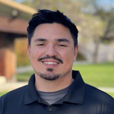 Profile picture of a young male with dark hair smiling.
