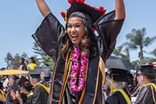 grad_site_2020_smaller.jpg Photo of students smiling and happy to be graduating.