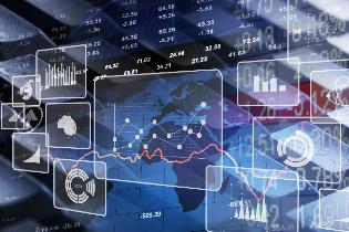 Stocks, charts, and graphs laid over a keyboard and a map of the world. 