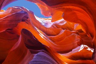 Upward view inside a rock formation.