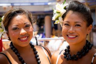 Two women of color in traditional clothing