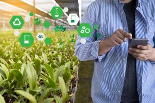 plants and person holding iphone with scientific symbol icons