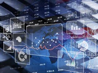 Stocks, charts, and graphs laid over a keyboard and a map of the world. 