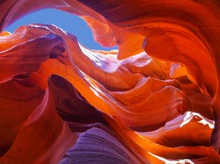 Upward view inside a rock formation.