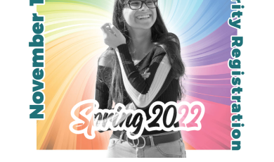 Young female college student looking upward with a rainbow b Young female college student looking upward with a rainbow b