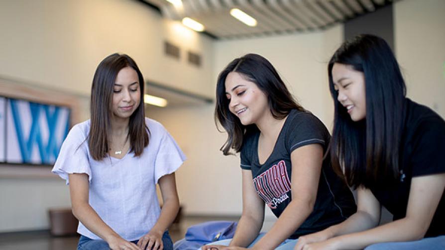 Students sitting in ASC building