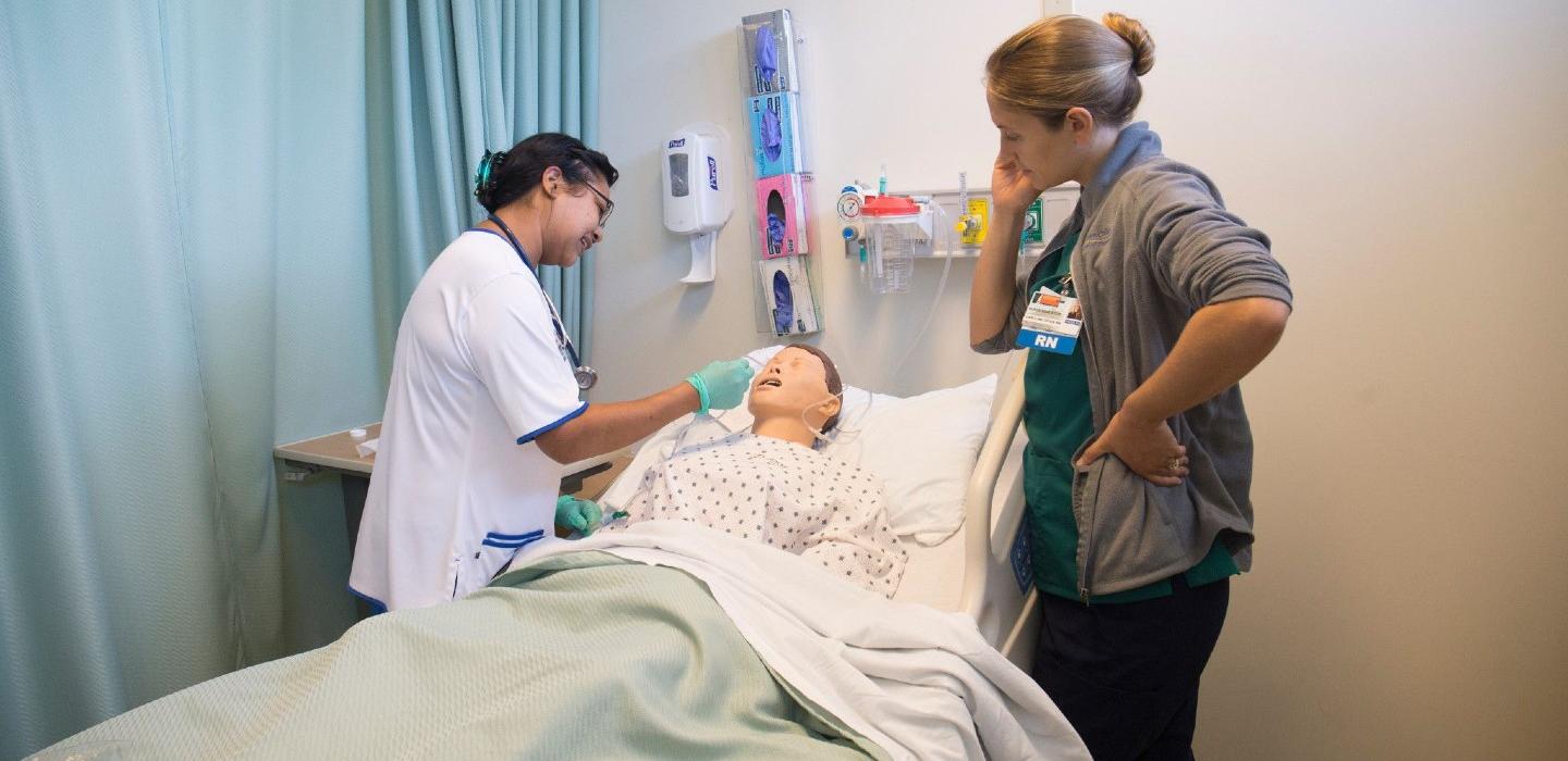 Nursing Faculty teaches patient care to nursing student