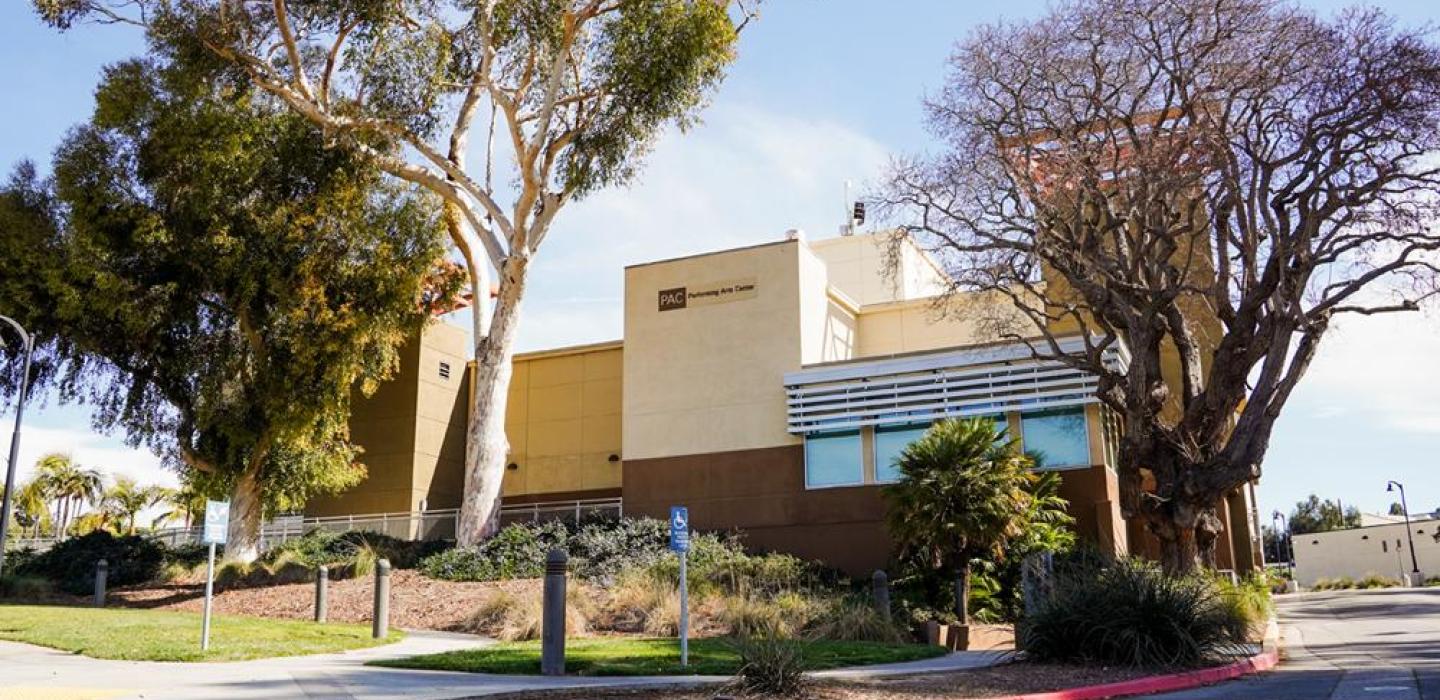 photo of the side of the performing arts building at ventura college with two trees on either side