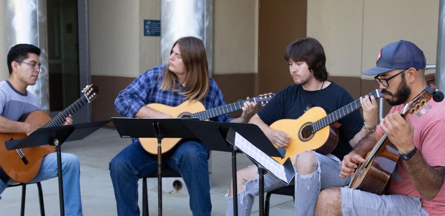 Guitar students rehearse