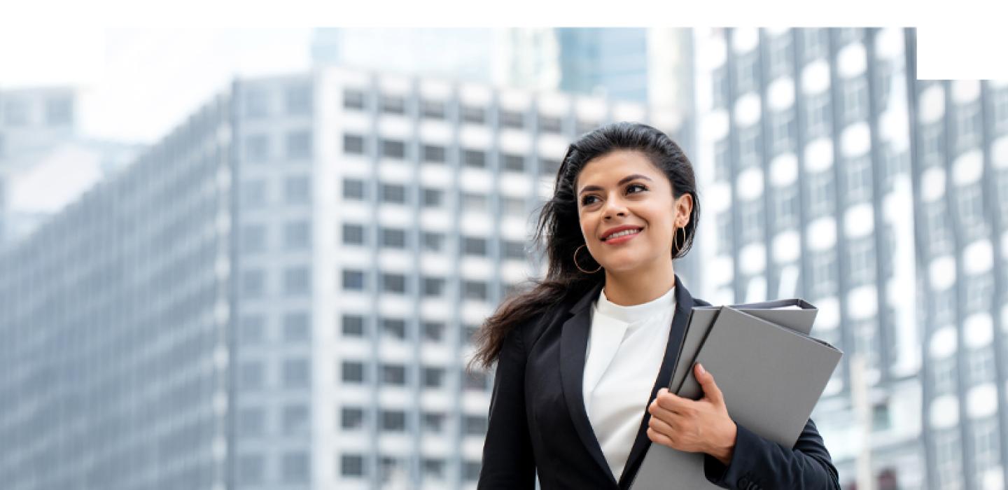 Business Woman in suit carrying folders