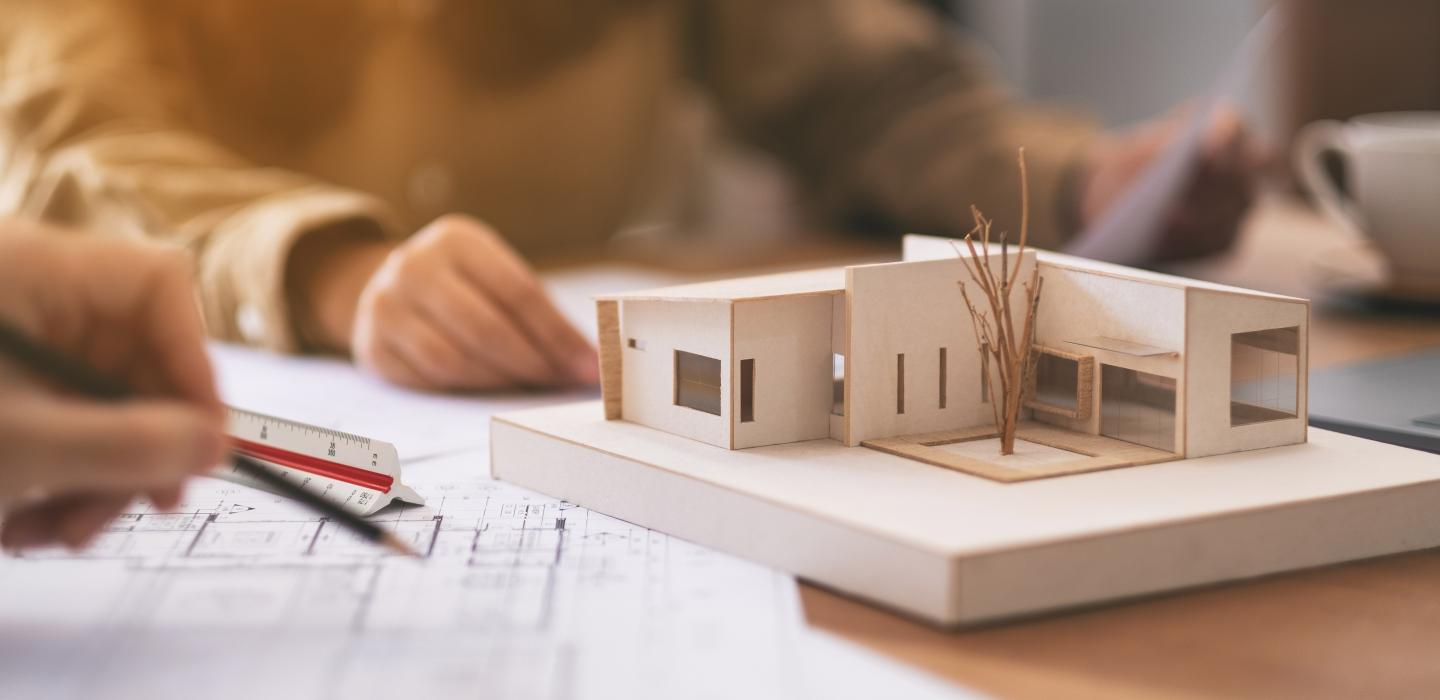 Students working on architecture wood model