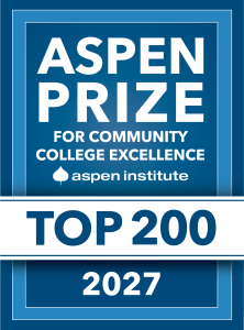 Blue and white graphic badge that reads: “Aspen Prize for Co