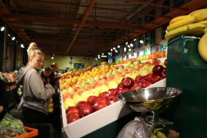 A young adult shopping for produce. A young adult shopping for produce.