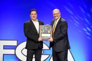 Ventura College football coach Steve Mooshagian, left, accepts the ACCFCA national Coach of the Year award from Wyoming head coach Craig Bohl in San Antonio. PHOTO COURTESY OF ISMAEL RODRIGUEZ